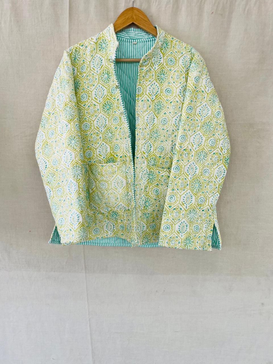 Breeze: a pale mint printed quilted jacket with a stand collar, patch pockets and striped lining