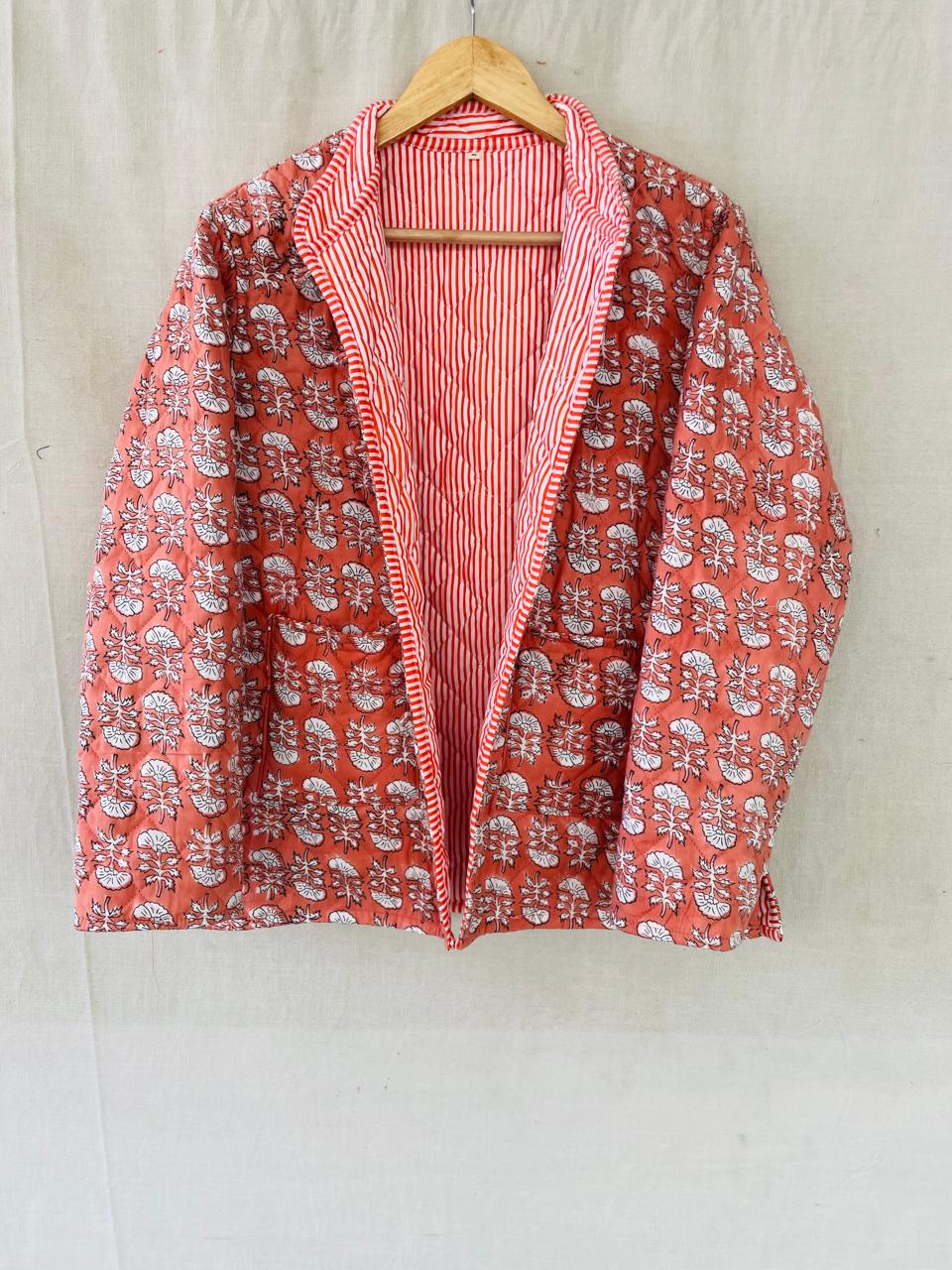 Elephants: a coral quilted jacket with a lapel, striped lining and patch pockets