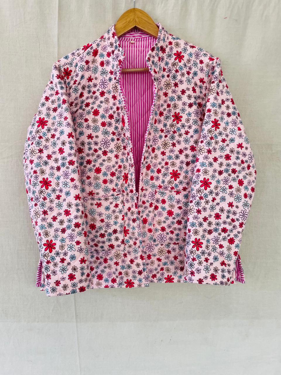 Field of Tulips: a pink floral quilted jacket with a stand collar and patch pockets